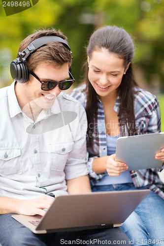 Image of students or teenagers with laptop computers