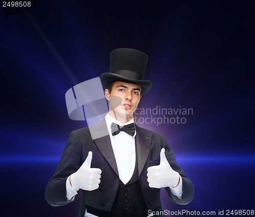 Image of magician in top hat showing thumbs up