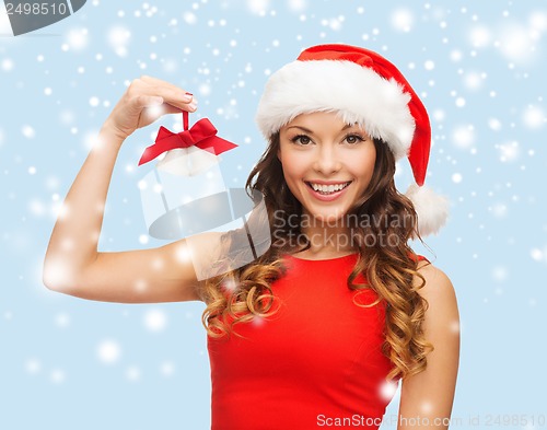 Image of woman in santa helper hat with jingle bells