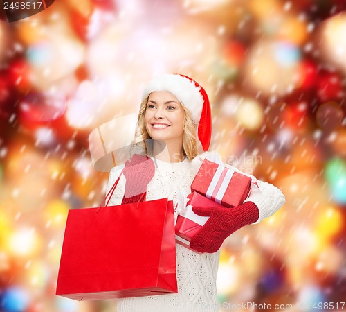 Image of woman in santa helper hat with shopping bags