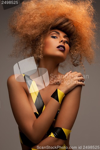 Image of woman with long curly hair