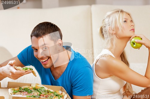 Image of couple eating different food