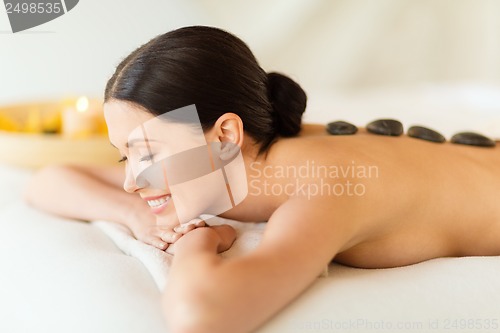 Image of woman in spa with hot stones