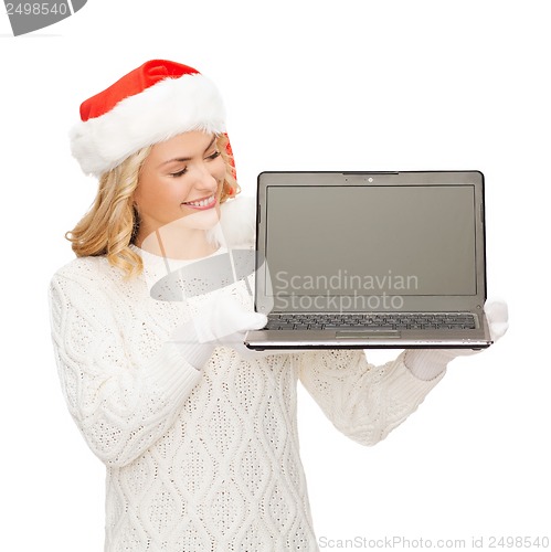 Image of woman in santa helper hat with laptop computer