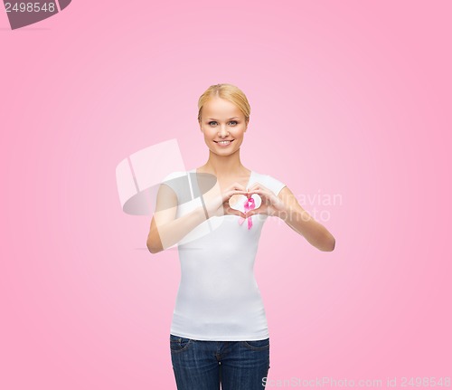 Image of woman in blank t-shirt with pink cancer ribbon