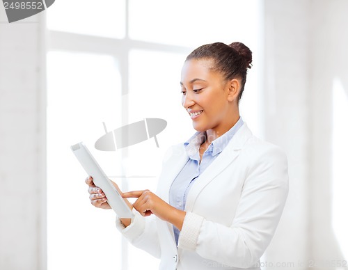 Image of businesswoman with tablet pc in office