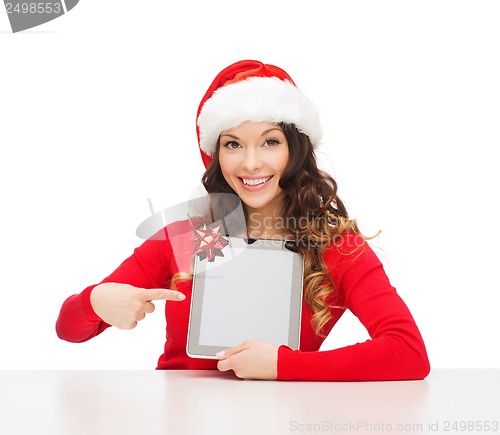 Image of woman in santa helper hat with tablet pc