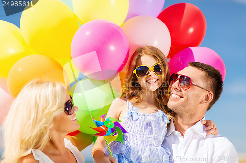 Image of family with colorful balloons