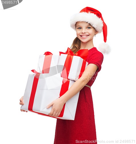 Image of girl in santa helper hat with many gift boxes