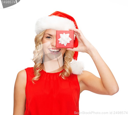 Image of smiling woman in santa helper hat with gift box