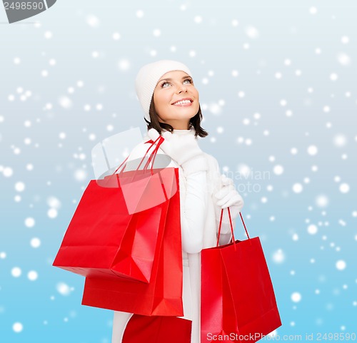 Image of picture of happy woman with shopping bags