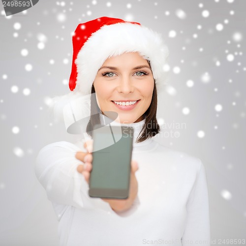 Image of woman in santa helper hat with smartphone