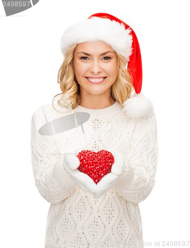 Image of smiling woman in santa helper hat with red heart