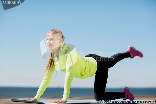 Image of woman doing sports outdoors