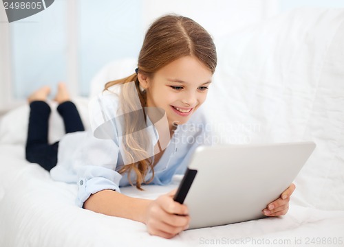 Image of girl with tablet pc at home