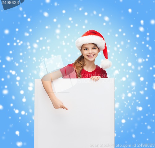 Image of woman in santa helper hat with blank white board