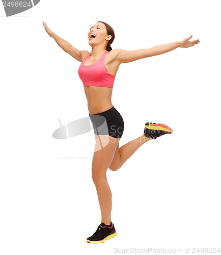Image of beautiful sporty woman running or jumping