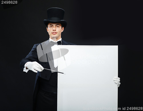 Image of magician in top hat with magic wand showing trick