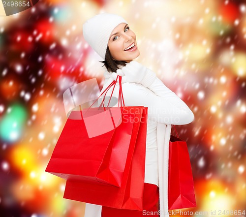 Image of picture of happy woman with shopping bags