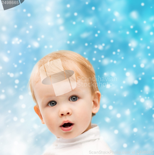 Image of happy little boy in winter clothes