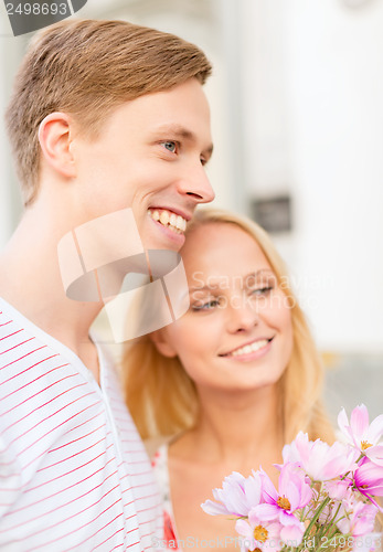 Image of couple with flowers in the city