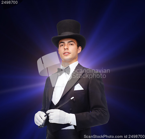 Image of magician in top hat with magic wand showing trick