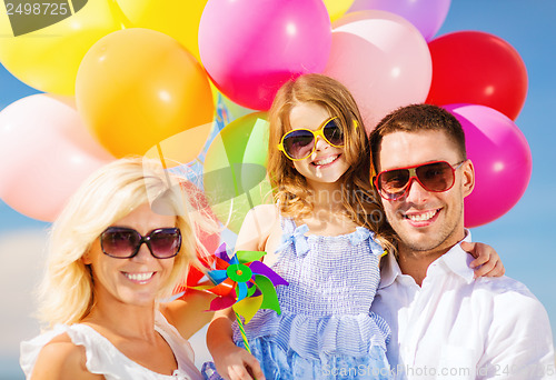 Image of family with colorful balloons
