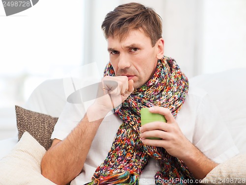 Image of ill man with flu at home