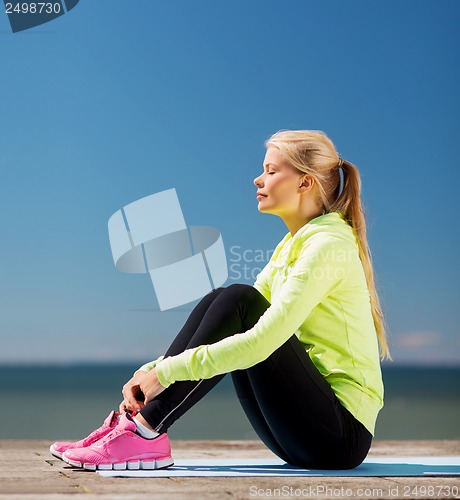 Image of woman doing sports outdoors