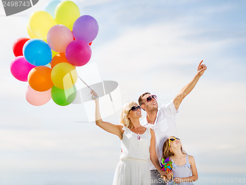 Image of family with colorful balloons