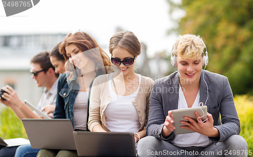 Image of students or teenagers with laptop computers