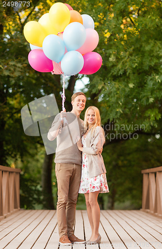 Image of couple with colorful balloons