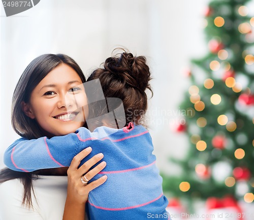 Image of hugging mother and daughter