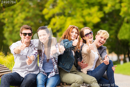 Image of group of students or teenagers showing thumbs up