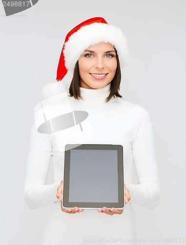 Image of woman in santa helper hat with tablet pc