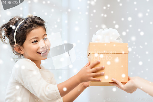 Image of happy child girl with gift box