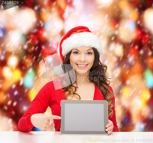 Image of woman in santa helper hat with tablet pc