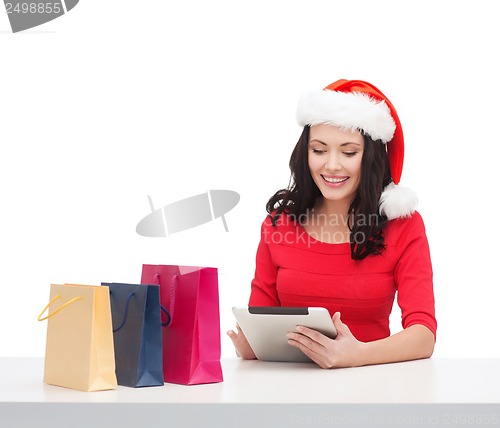 Image of woman with gift box and tablet pc computer