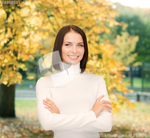 Image of smiling woman in white sweater