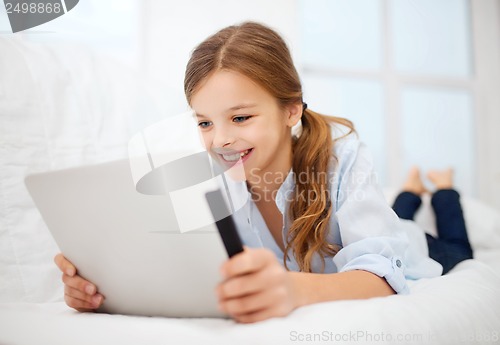 Image of girl with tablet pc at home