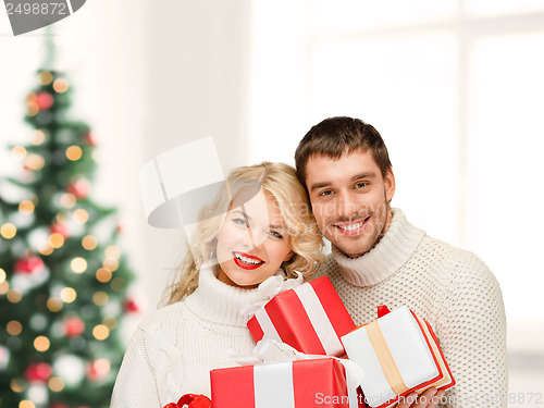 Image of smiling woman and man with gift box