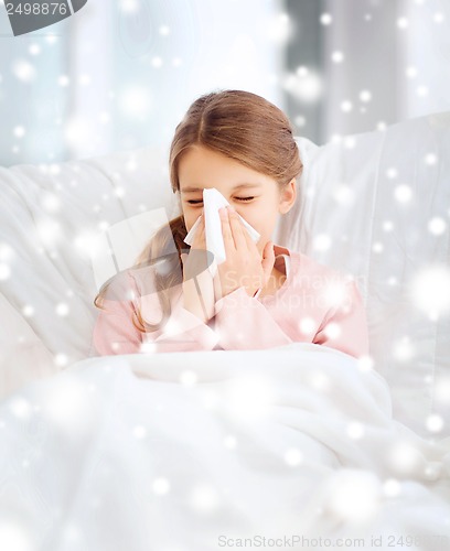 Image of ill girl with paper tissue