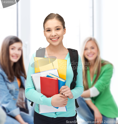 Image of student with books and schoolbag