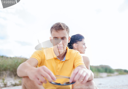 Image of stressed couple outside