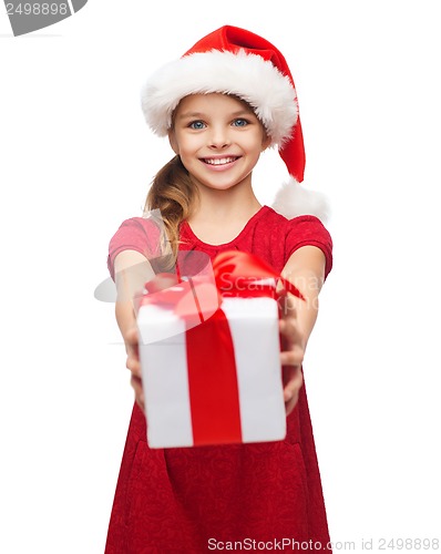 Image of smiling girl in santa helper hat with gift box