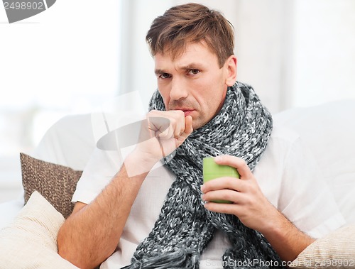 Image of ill man with flu at home
