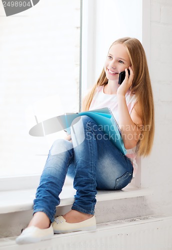 Image of girl with smartphone at school