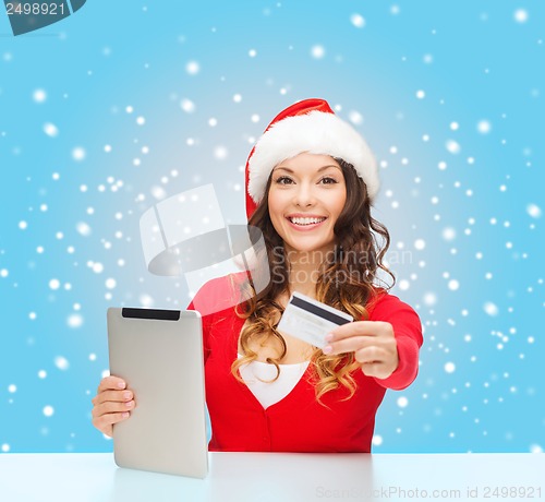 Image of woman with gift, tablet pc and credit card