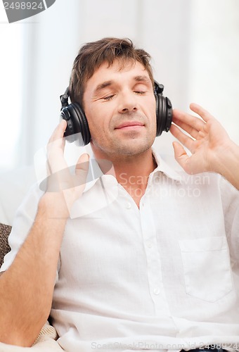 Image of man with headphones listening to music