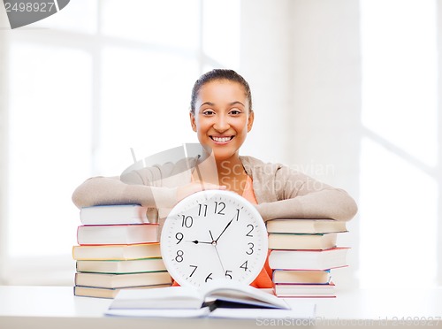 Image of attractive woman with white clock